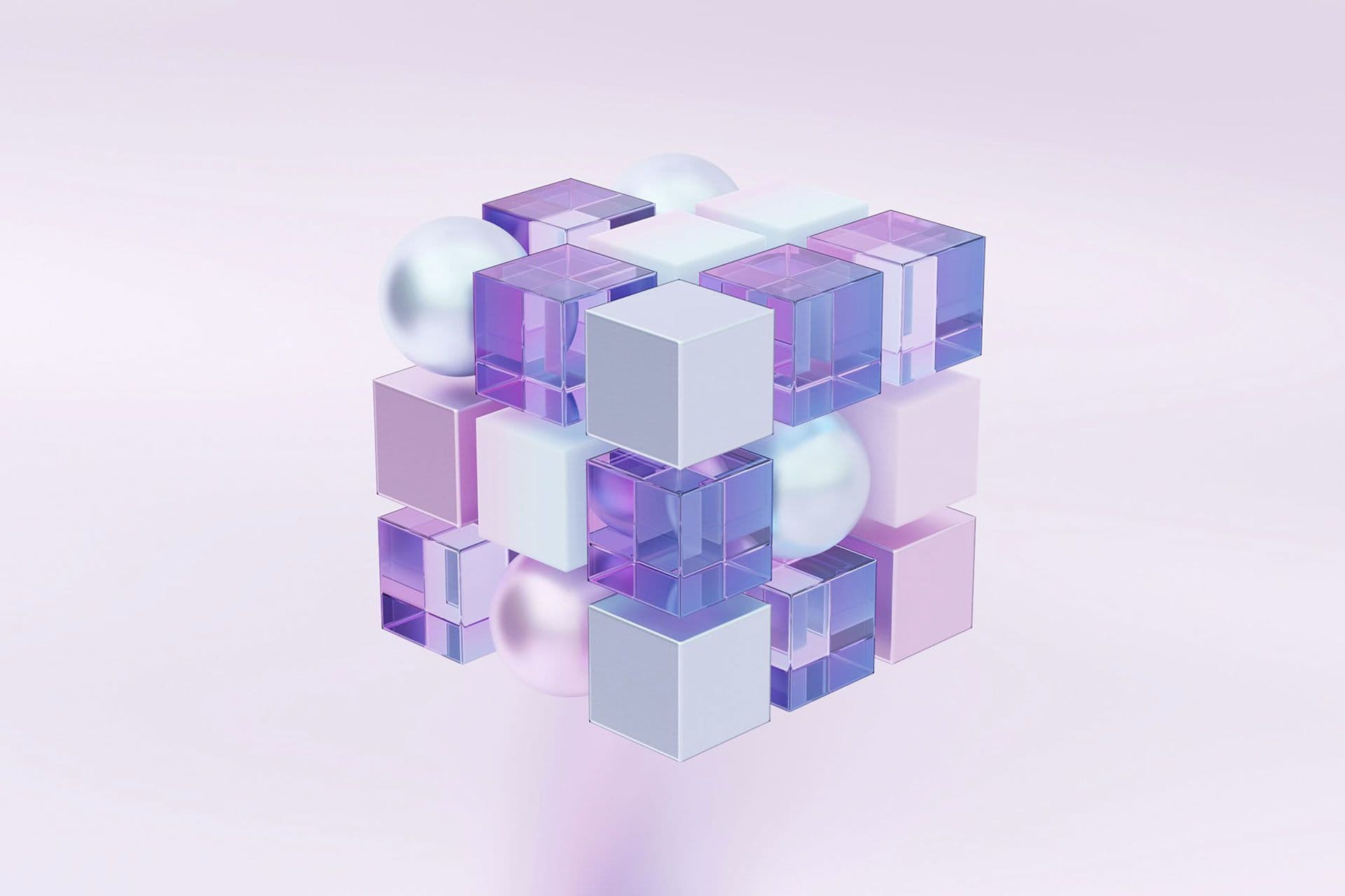 A cube built from glass, white and lilac blocks with pearl spheres, on a pale background.